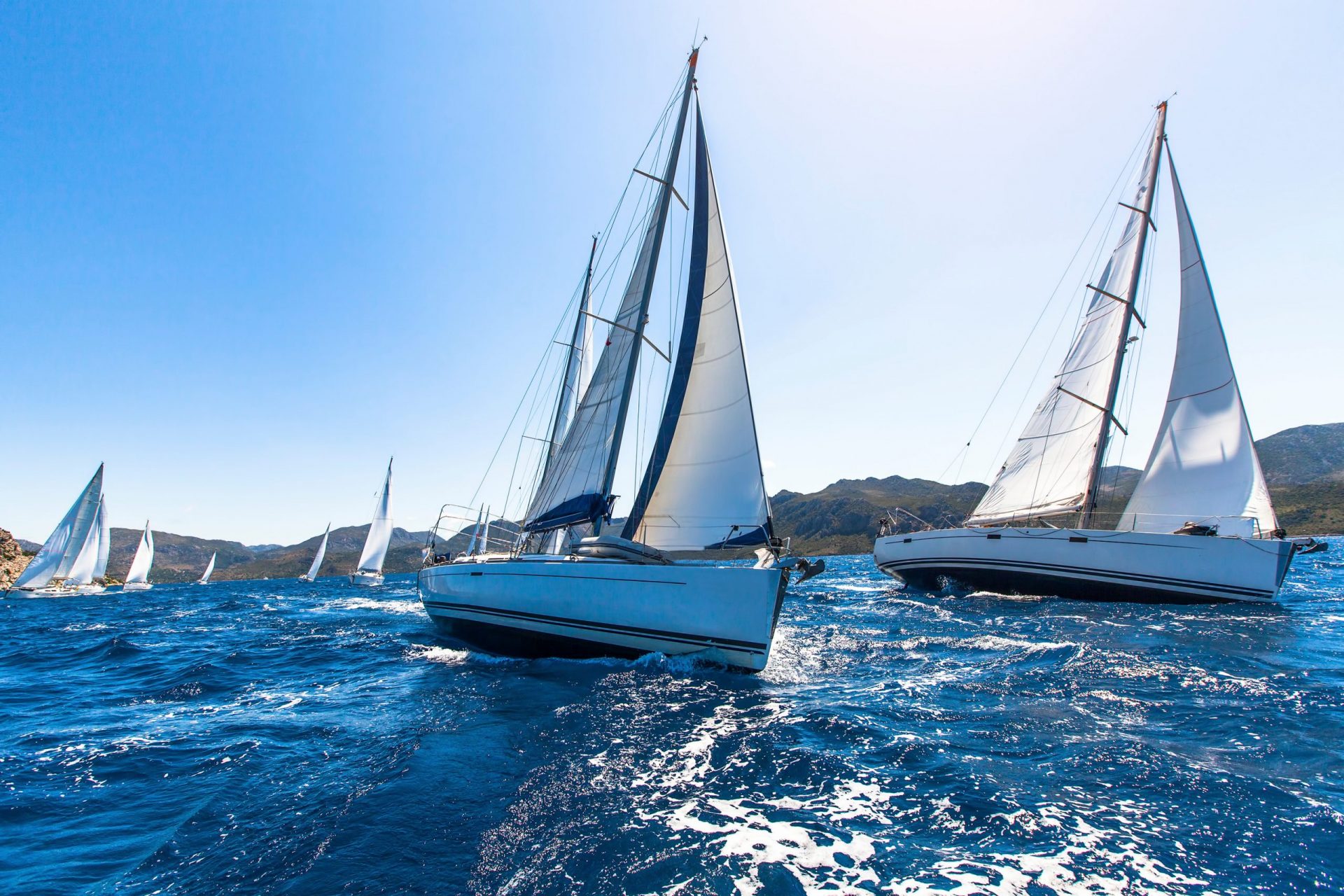 Sailing in the wind through the waves at the Aegean Sea.